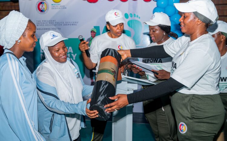  PRESIDENT DEPOWA GIVES 100 GYM MATS TO EARLY ATTENDEES AT DEPOWA MONTHLY AEROBICS EXERCISE SESSION